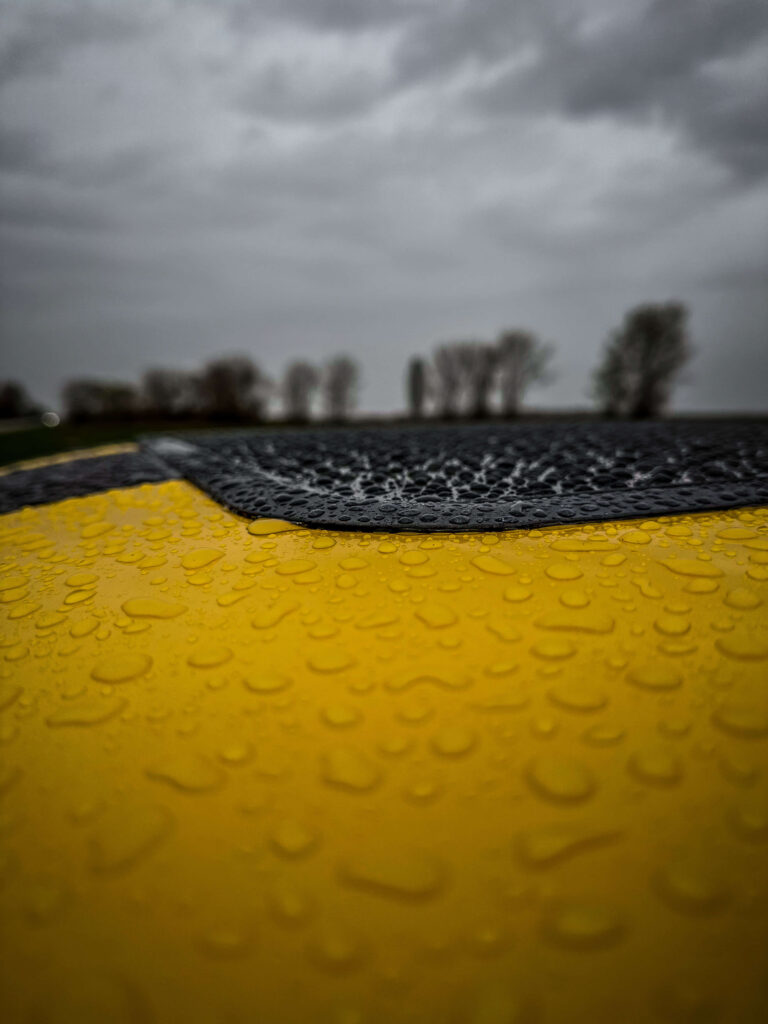 "Bumblebee" yellow Ford Mustang raindrop macro shot 